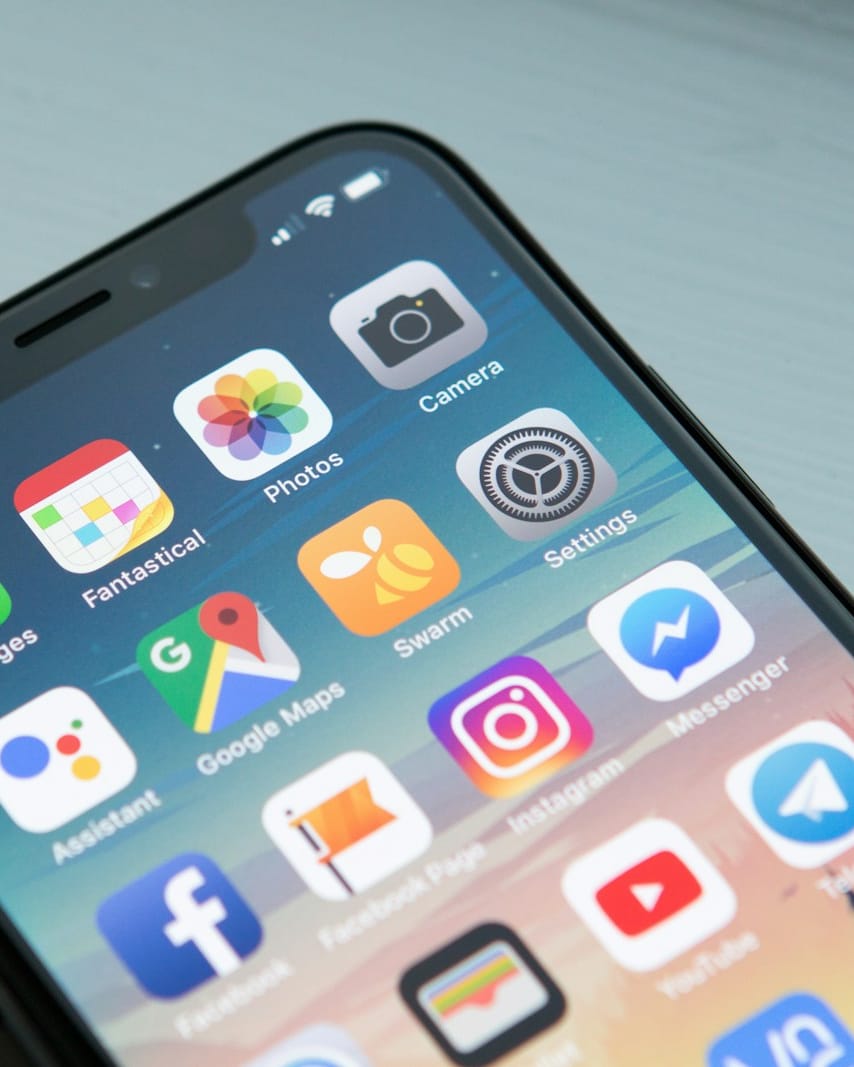 Phone showing the app on a desk